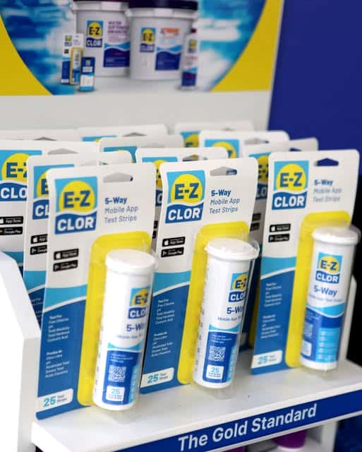 Packaged EZ-Clor pool water-care products are displayed on a retail shelf.
